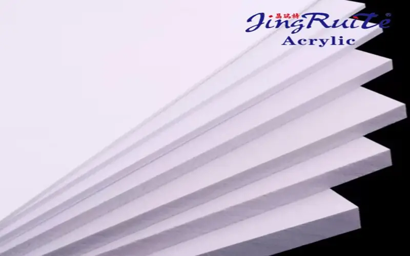 A stack of white PVC foam board sheets for B2B signage and display fabrication