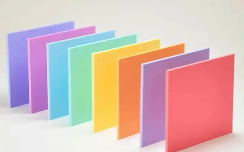 A row of multi-colored pastel acrylic sheets with a matte finish, showcasing soft color saturation for decorative lighting design.