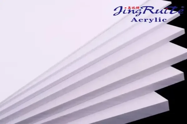 A stack of white PVC foam board sheets for B2B signage and display fabrication
